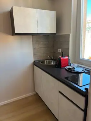 a kitchen with a sink and a counter top at Mila house suite in Rome