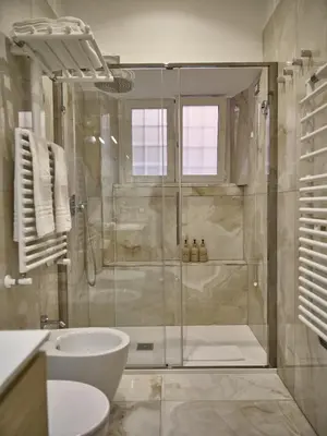 a bathroom with a shower and a sink at King Vittorio Guest House in Rome