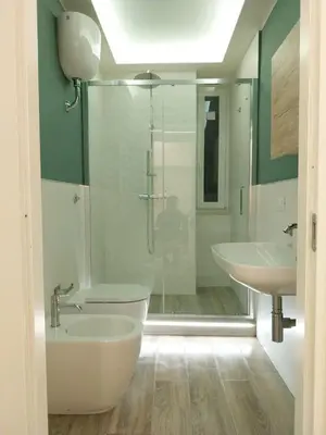a bathroom with a shower and a toilet and a sink at Urbanflat Termini in Rome