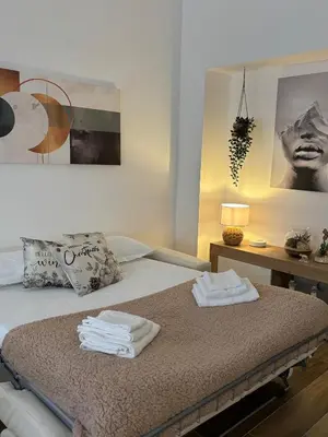 a bedroom with a bed with towels on it at Domus Gregorio VII in Rome