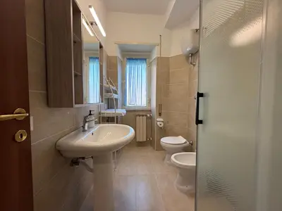 a bathroom with a sink and a toilet at Metro A Battistini - Ramat House in Rome