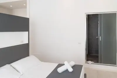a room with a bed with a cross on it at Ottavilla Apartment in Rome