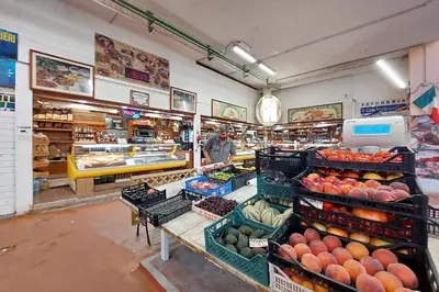 a store filled with lots of fruits and vegetables at Flaminio Arte & Musica in Rome
