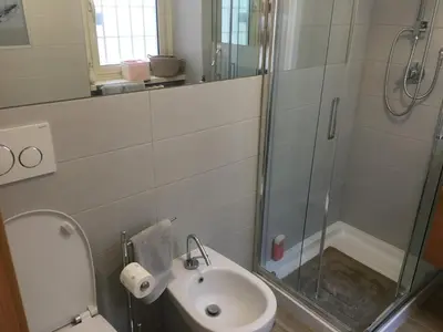 a bathroom with a toilet and a sink and a shower at Francy's home sweet home in Rome