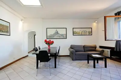 a living room with a couch and a table at Appartamento Lavatore in Rome