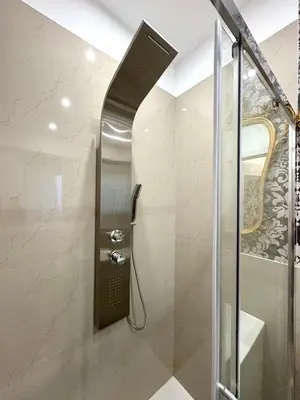 a shower with a glass door in a bathroom at La Canfora in Rome