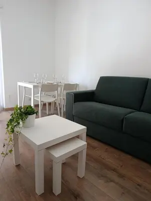 a living room with a couch and a table at Rome Tiburtina Terrace Inn - casa vacanze in Rome