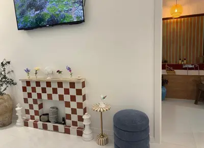a living room with a fireplace and a tv on the wall at Midorigami Jacuzzi suite Spanish Steps apt in Rome