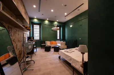 a bedroom with a bed and a couch and a tv at Alloggio turistico di Filomena Landi in Rome