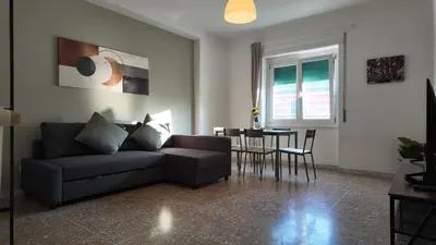 a living room with a couch and a table at Vatican St Peter Apartment in Rome