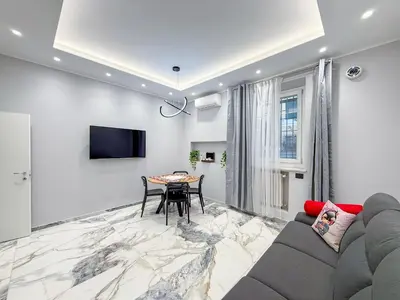 a living room with a couch and a table at Feffo's home - Casa per 4 persone in Rome