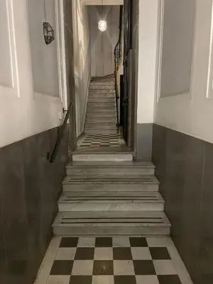 a staircase in a building with a checkered floor at Civico43 in Rome