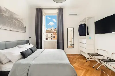 a bedroom with a large bed and a window at Pantheon Winning Position in Rome