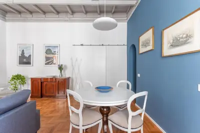 a dining room with a white table and chairs at Elegance near Navona-for 5 guests in Rome