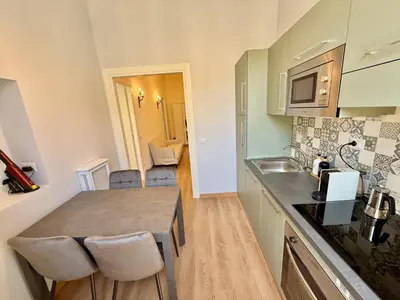 a kitchen with a sink and a counter top at ETERNA Repubblica Apartment in Rome