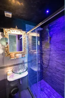 a bathroom with a shower and a sink and a mirror at Vaticano Julia Guest House in Rome
