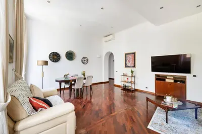 a living room with a couch and a table at Pigneto House - Residenze Romanae in Rome