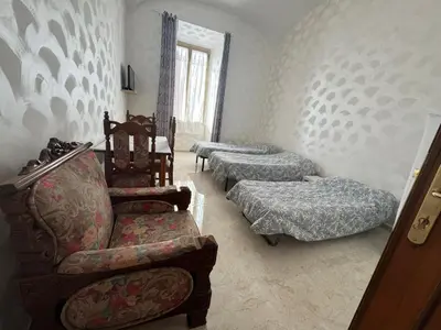 a living room with two beds and a couch at B&B Kevin's Home in Rome
