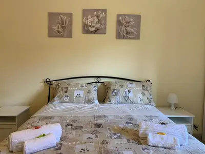 a bedroom with a bed with pillows on it at Da Giulia in Rome