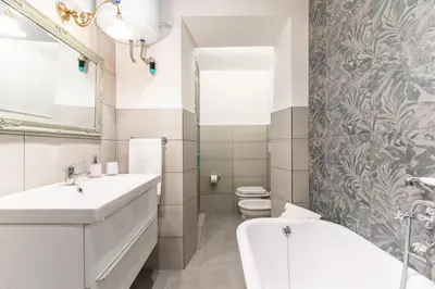 a bathroom with a sink and a tub and a toilet at Top Location - walk to Navona Pantheon and Vatican in Rome