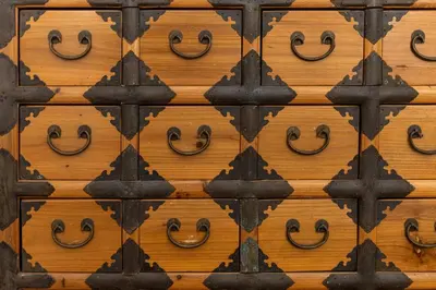 an old wooden door with black iron hinges at Apartment AppiaAntica in Rome
