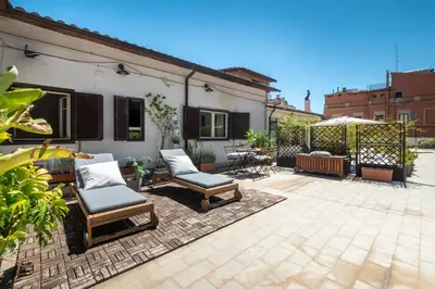 a patio with two chairs and a gazebo at Laura Roof Terrace Teatro dell'Opera in Rome