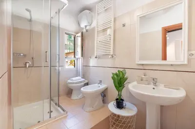 a bathroom with a sink and a toilet and a shower at Laura Roof Terrace Teatro dell'Opera in Rome