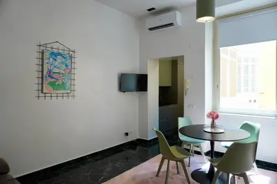a dining room with a table and chairs at DOMUS Generale Ezio in Rome