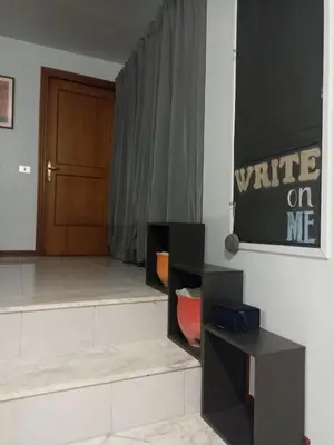 a room with a write on me sign on the wall at casaemily TrenoFiumicinoAir-VillaBonelli-Ostiense in Rome