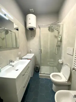 a bathroom with a shower and a toilet and a sink at Balduina Boutique Apartment in Rome
