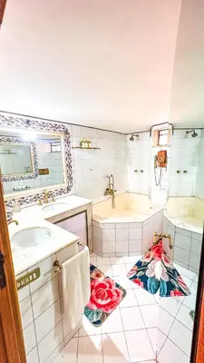a bathroom with a tub and a sink at Trastevere Tranquility Rome in Rome