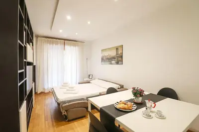 a hospital room with a bed and a table at Free Parking Chic Home - Balcony, AC, Wi-Fi in Rome