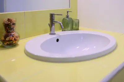 a white sink with a faucet in a bathroom at Step to the Vatican in Rome
