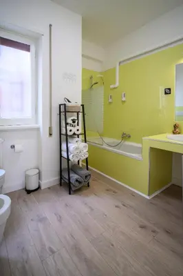 a bathroom with a tub and a sink and a toilet at Step to the Vatican in Rome