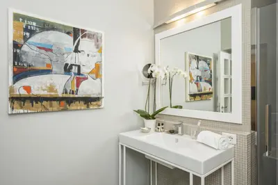 a bathroom with a sink and a mirror at Maison Evelina in Rome