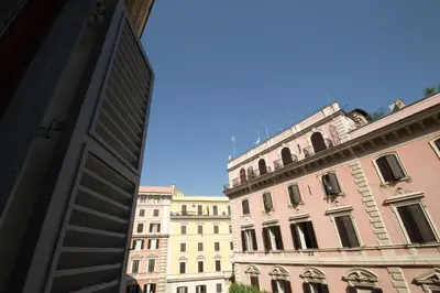 a view of two buildings and a blue sky at Vantaggio Apartment in Rome