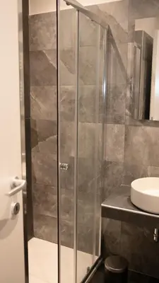a bathroom with a shower and a sink at Suites 215 Colosseum - Guesthouse in Rome