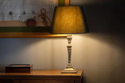a lamp sitting on top of a wooden table at Santonofrio SKY Terrace Penthouse in Rome