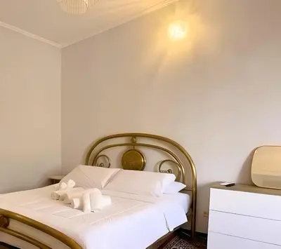 a bedroom with a bed with two towels on it at SR Guesthouse in Rome