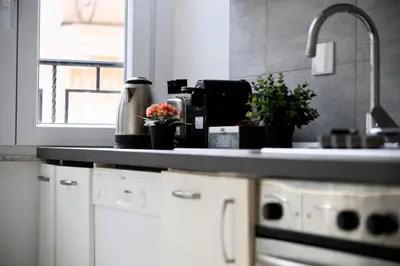a kitchen with a counter top and a sink at A due passi dal Colosseo - Vista città - Luxury in Rome