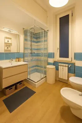a bathroom with a shower and a sink and a toilet at Tiepolo La Vie Apartment - Rome Flaminio in Rome
