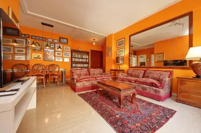 a living room with two couches and a table at Pascarella - Trastevere in Rome