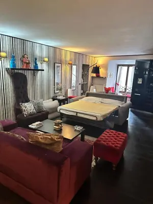 a living room with a bed and a couch at Apt Aurea Luxury Pantheon View in Rome
