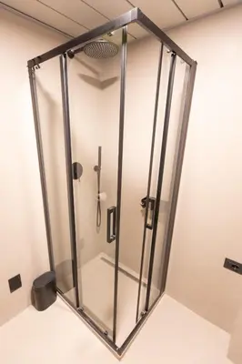a shower stall in a room with a glass door at Pantheon-Rondanini - Cozy Apartment in Rome