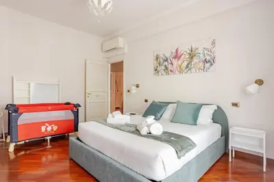 a bedroom with a bed with two teddy bears on it at Family House 10 Min Metro Conca d'Oro in Rome