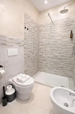 a small bathroom with a sink and a toilet at Appio Rooms Haven in Rome