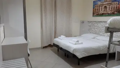 a hospital room with a bed with towels on it at IL Sole in Rome