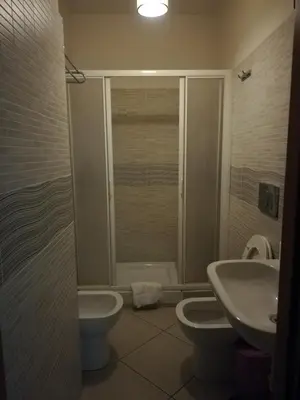 a bathroom with a toilet and a sink and a shower at IL Sole in Rome