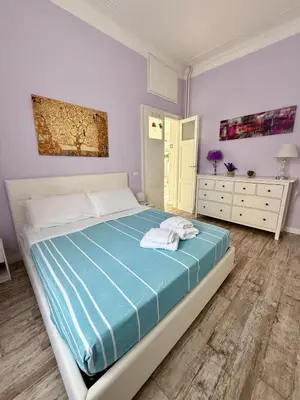 a bedroom with a bed with two towels on it at LaReginetta in Rome