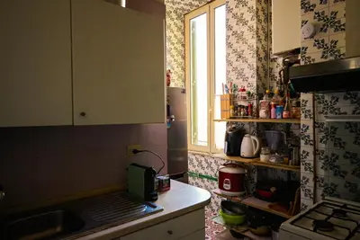 a small kitchen with a sink and a window at PP Stanza Privata in Appartamento Pigneto in Rome